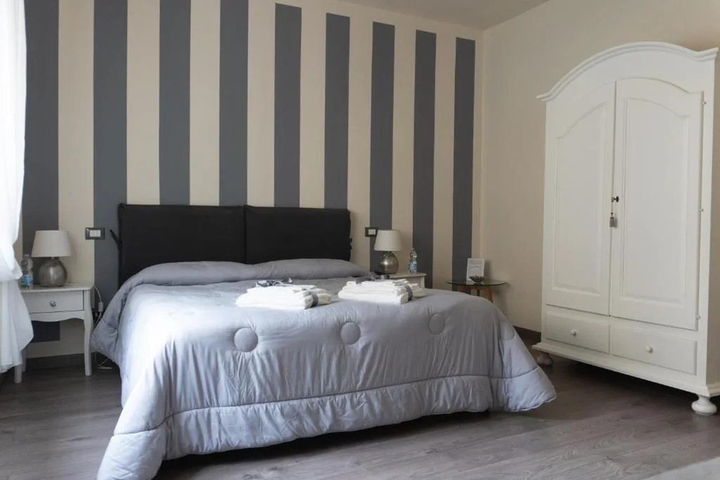 Camera Matrimoniale Deluxe con 1 Letto Supplementare — Madame Pucci