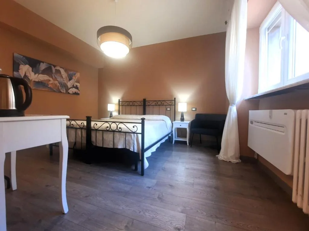 Camera Matrimoniale/Doppia con Letti Singoli — Madame Pucci