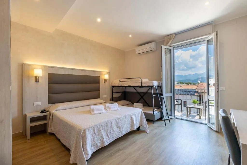 Quadruple Room with Balcony — Hotel Biagi & Residence