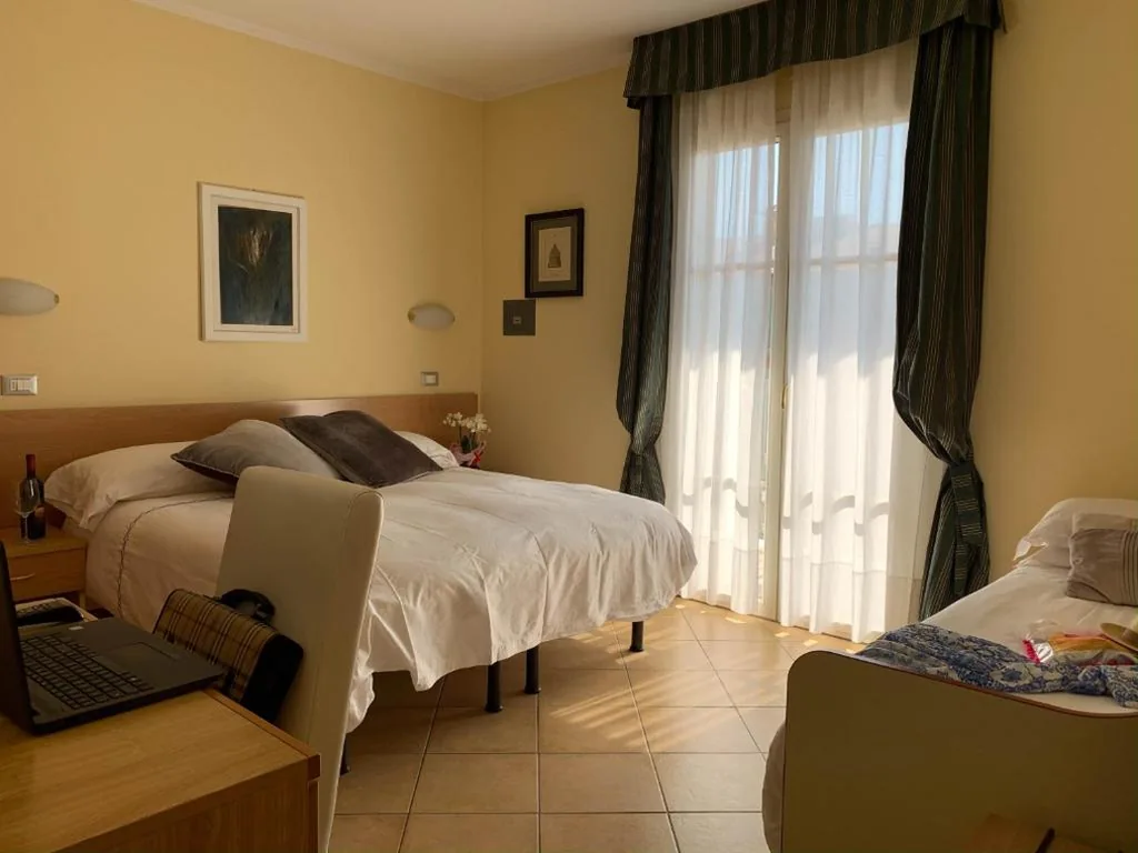 Quadruple Room with Balcony — Hotel La Bitta