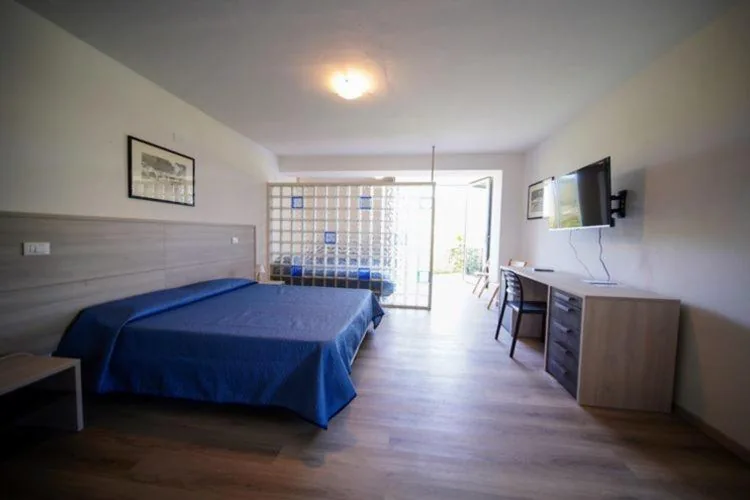 Quadruple Room with Sea View — Hotel Capo Di Stella