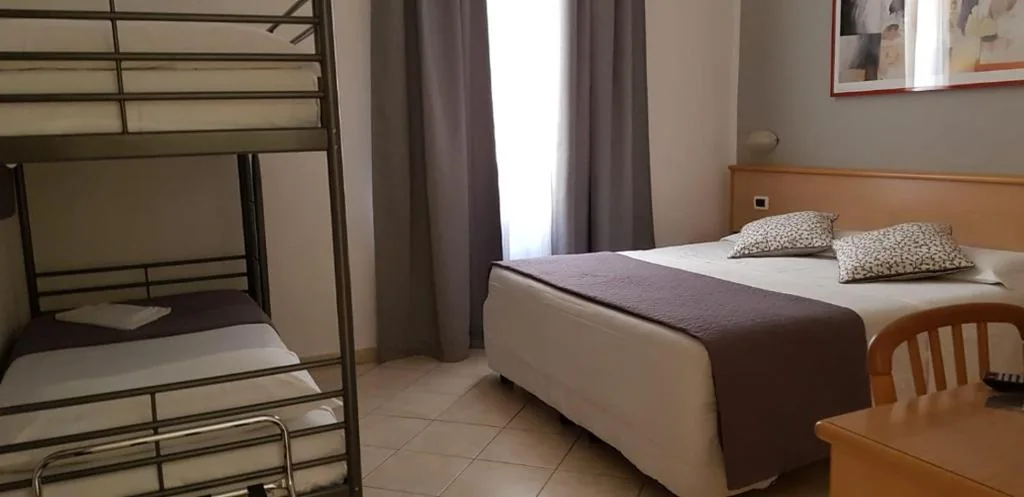Quadruple Room — Hotel Astor