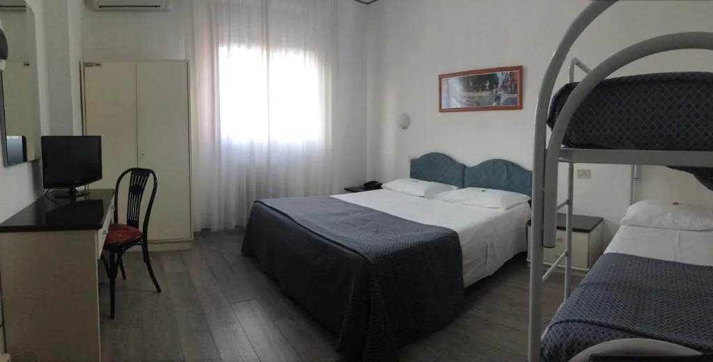 Quadruple Room — Hotel Capitol