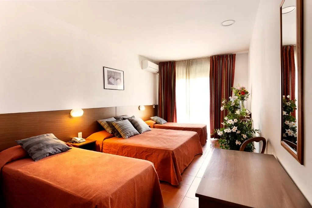 Quadruple Room — Hotel Corolle