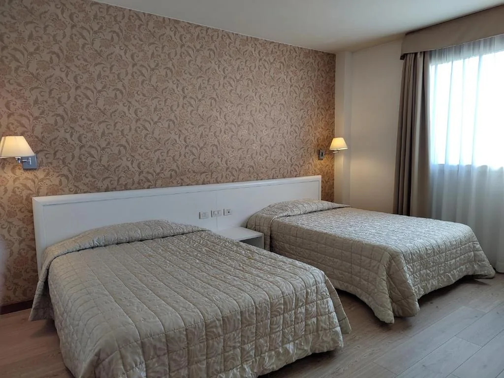 Quadruple Room — Hotel Datini
