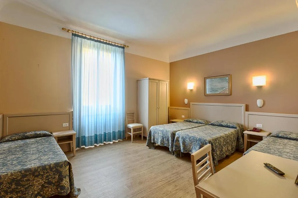 Quadruple Room — Hotel Eden