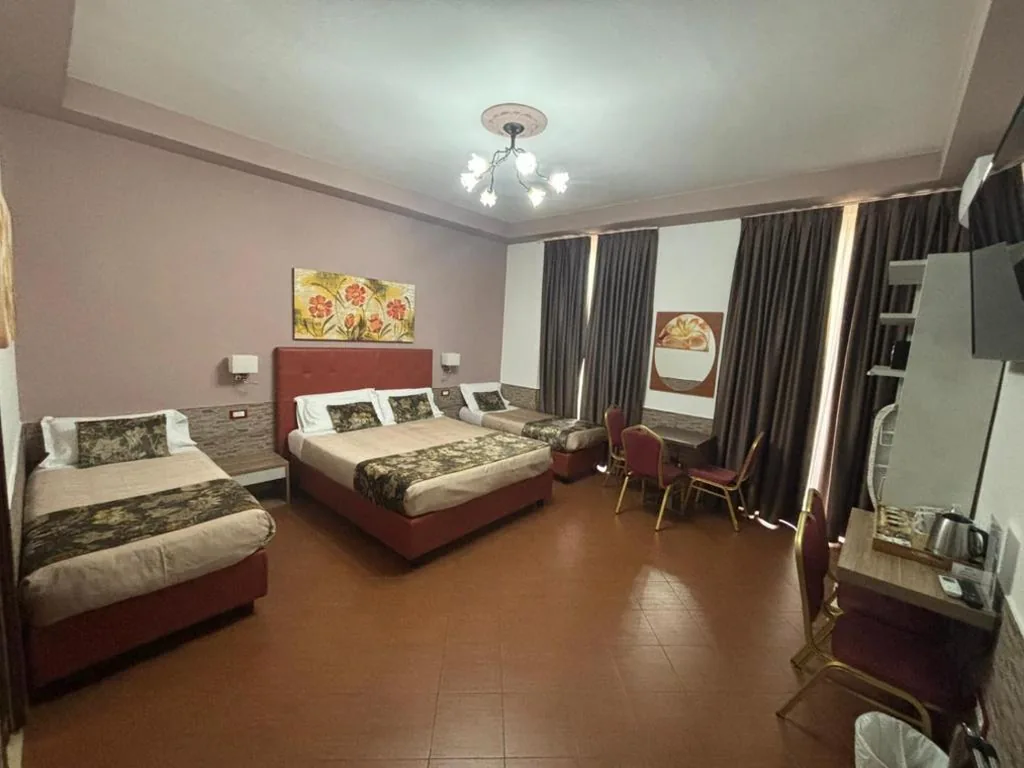 Quadruple Room — Hotel Ester