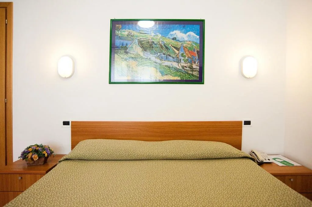 Quadruple Room — Hotel La Toscana