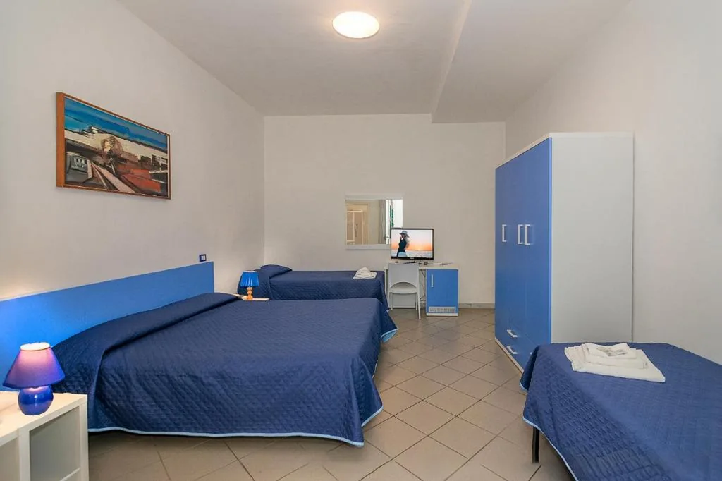 Quadruple Room — Hotel Rex