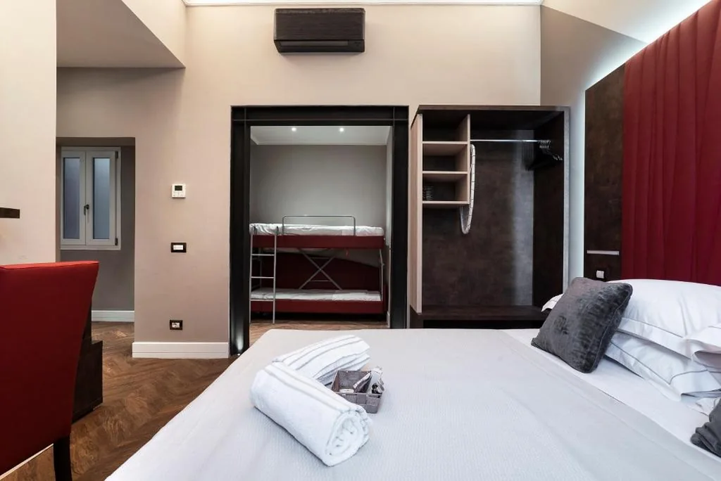 Superior Quadruple Room — Artemide Guest House