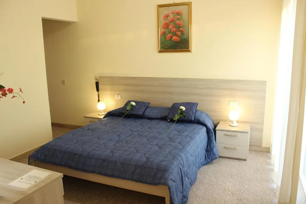 Superior Quadruple Room — Hotel Luca