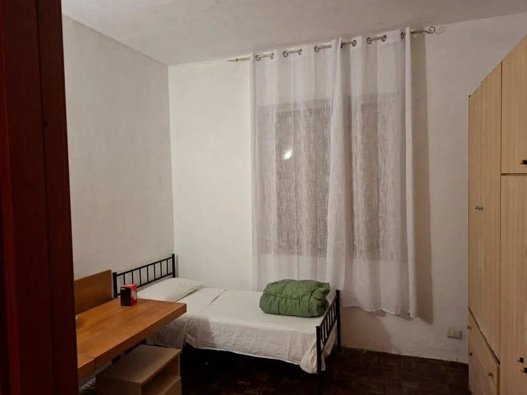 Single Room with Shared Bathroom — Bed in Siena