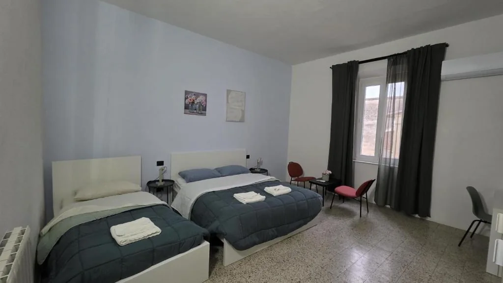 Basic Triple Room with Shared Bathroom — Hope Apartment