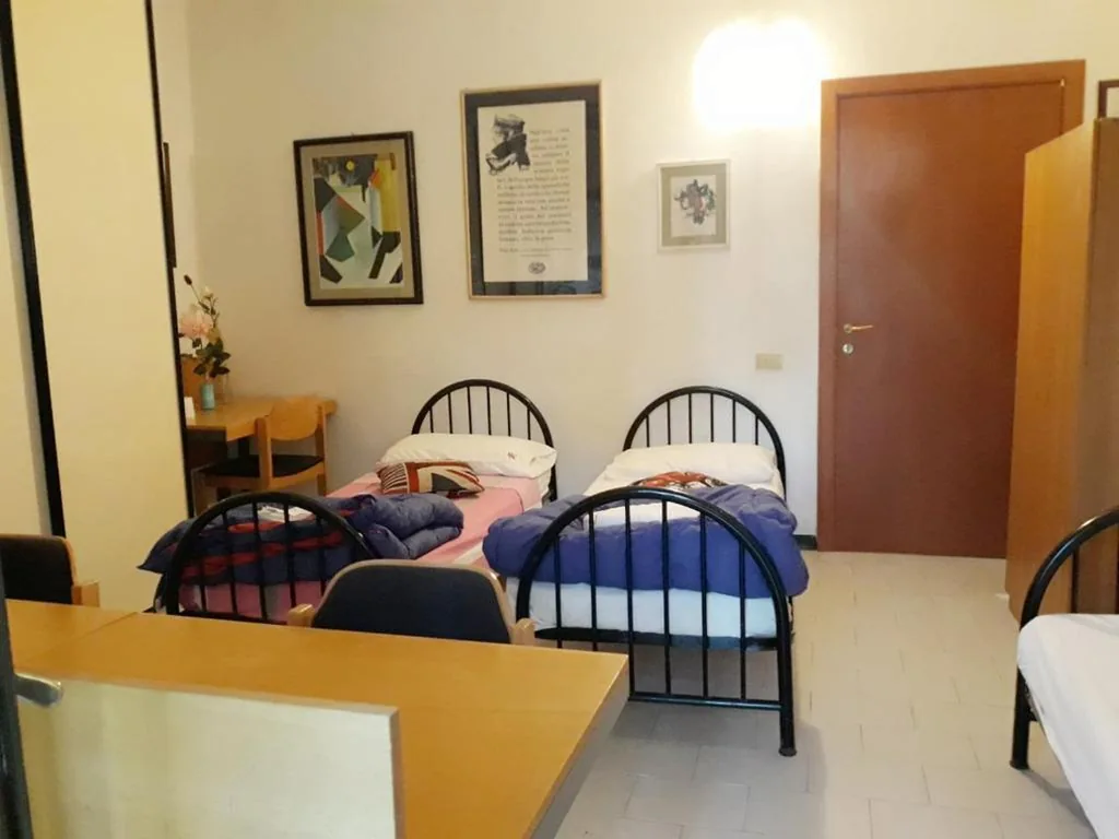 Triple Room with Shared Bathroom — Bed in Siena