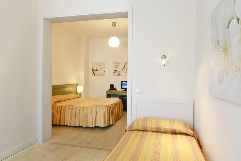 Triple Room with Balcony — Hotel Lupori