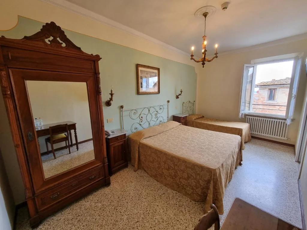 Camera Tripla con Vista Città — Albergo Il Marzocco – Hotel dal 1860