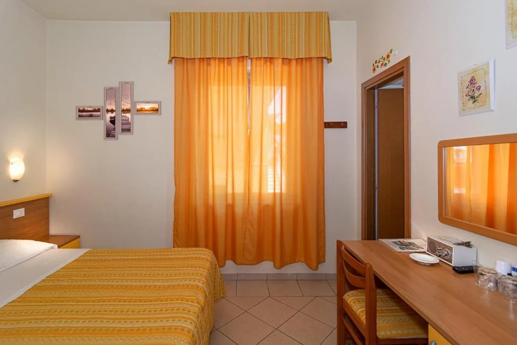 Deluxe Triple Room — Hotel Mariani