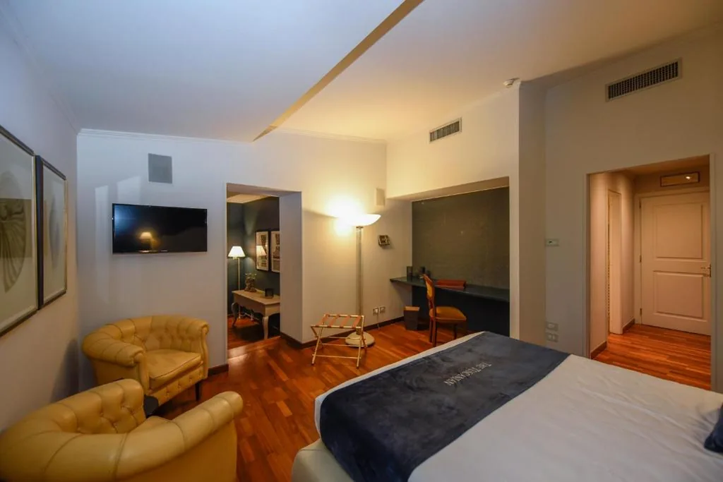 Deluxe King Suite — The Tuscanian Hotel