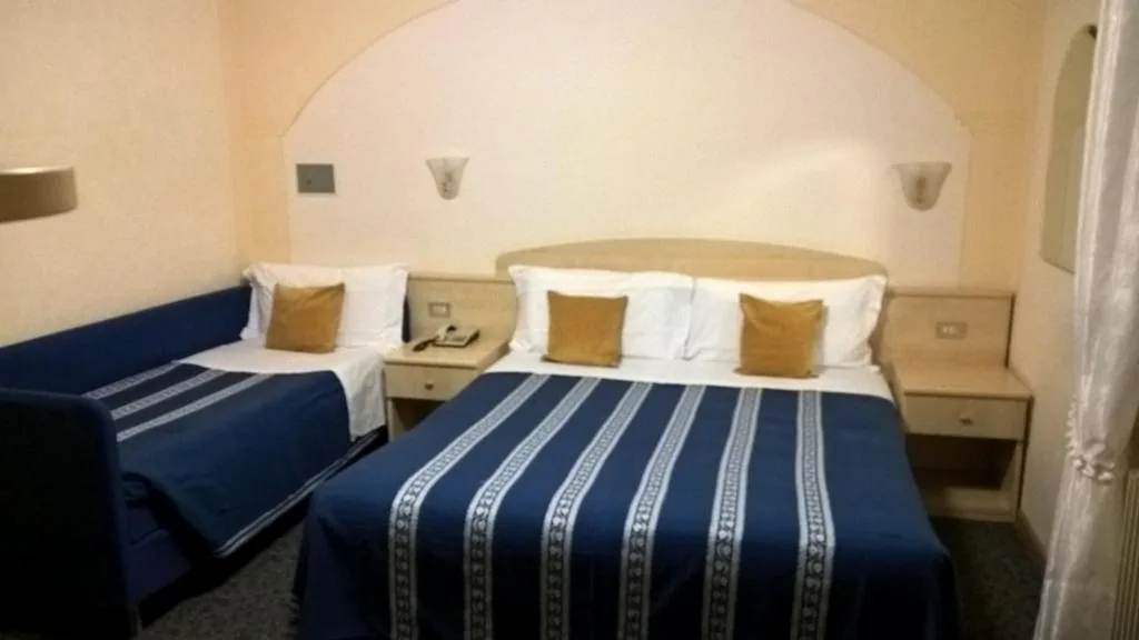 Family Room (2 Adults + 1 Child) — Albergo Stella Alpina