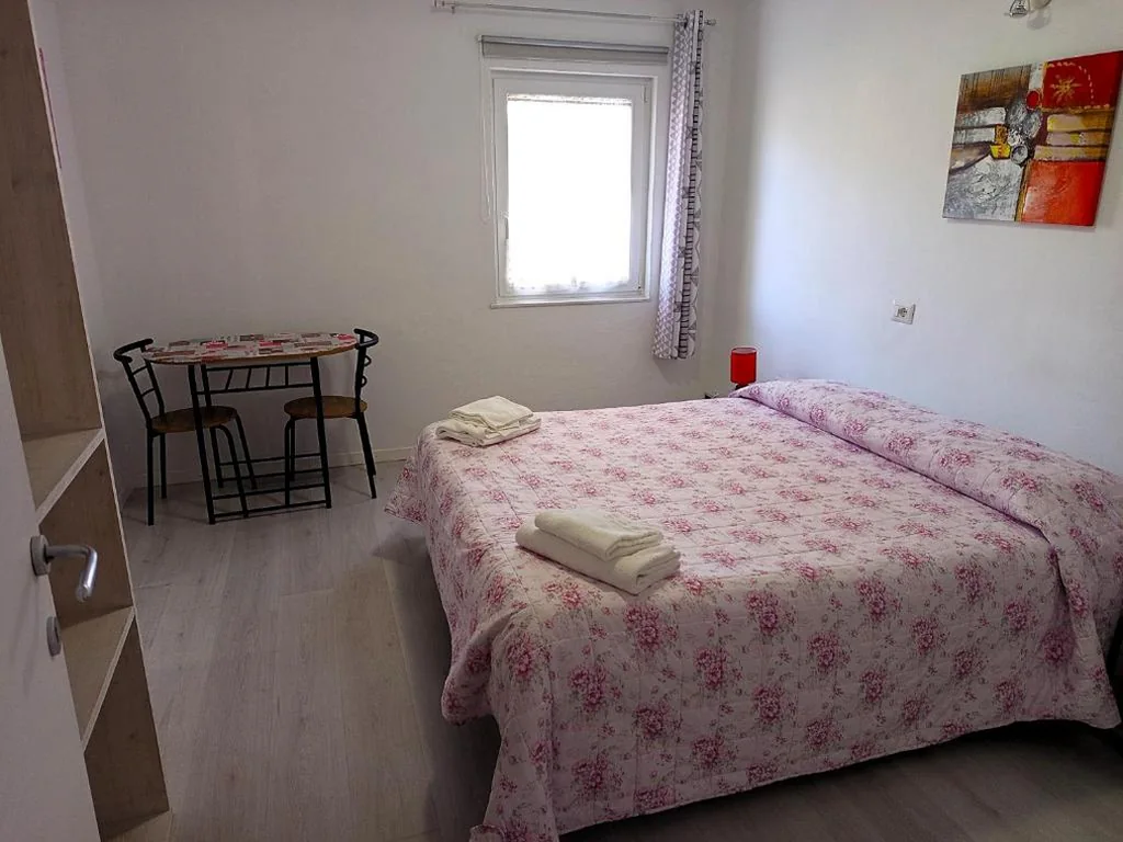 Camera Quadrupla con Vista Lago — Garden Belvedere B&B