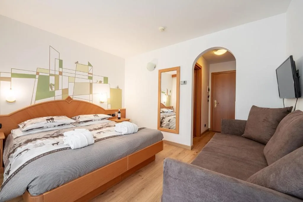 Camera Tripla Deluxe — Hotel Dolomites Inn