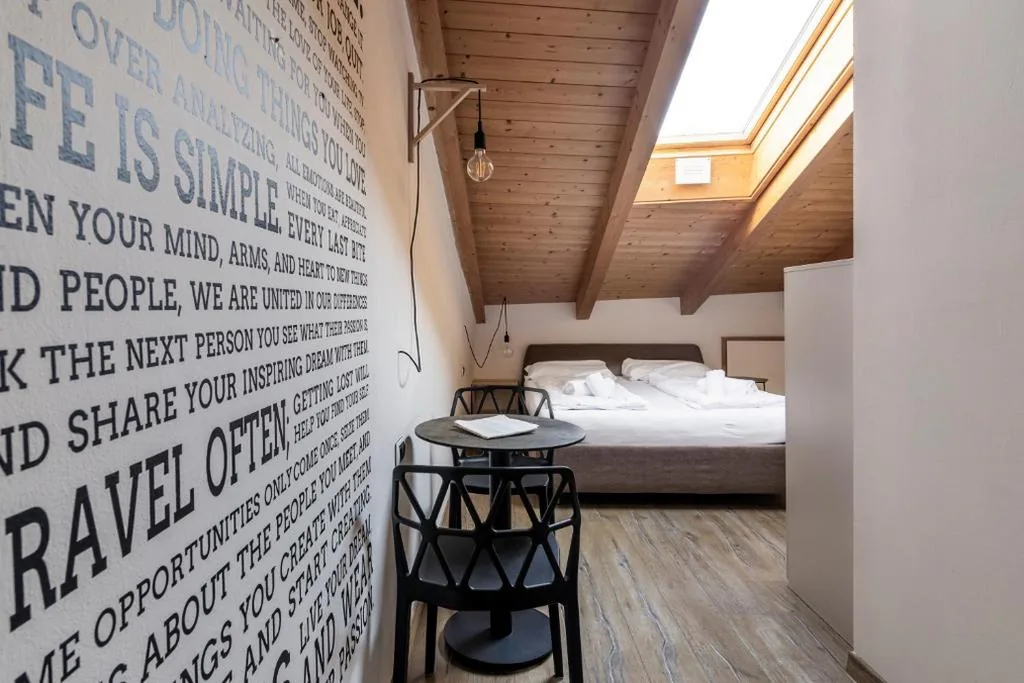 Standard Triple Room with Air Conditioning - Attic — Stay COOPER l Goethe Guesthouse