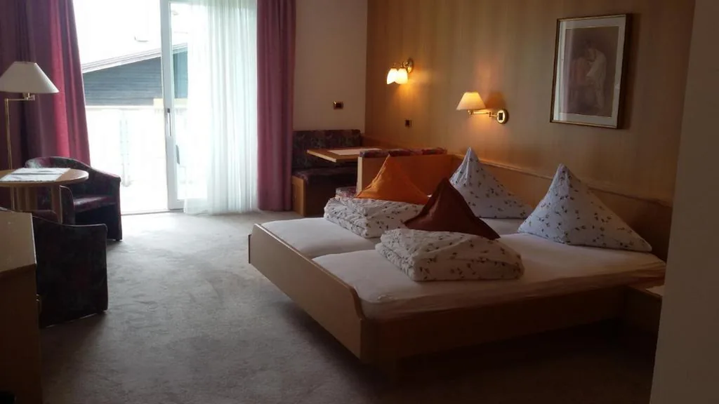 Junior Suite with Balcony — Hotel Maximilian