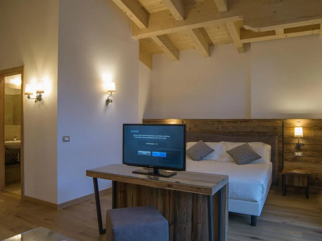 Junior Suite — Hotel Garnì Caminetto