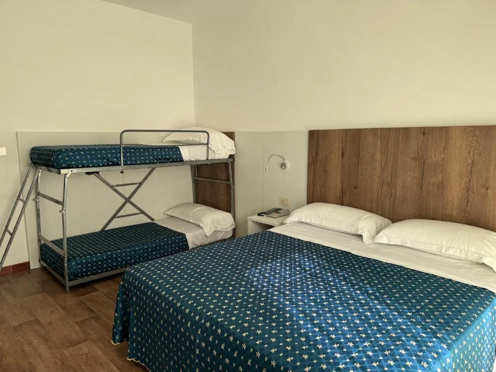 Family Room (2 Adults + 2 Children) — Hotel Al Capitano