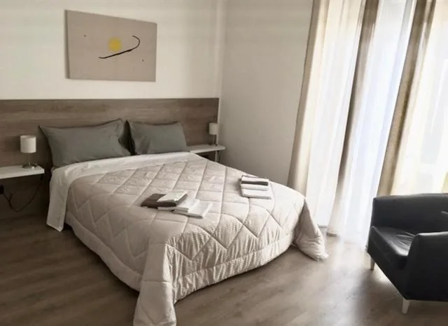 Double Room with Shared Bathroom — Fiore di Loto