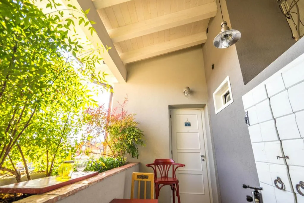 Camera Matrimoniale con Balcone — Mansarda 64