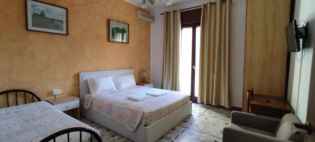 Double Room with Extra Bed and Shared Bathroom — The Caponi Bros