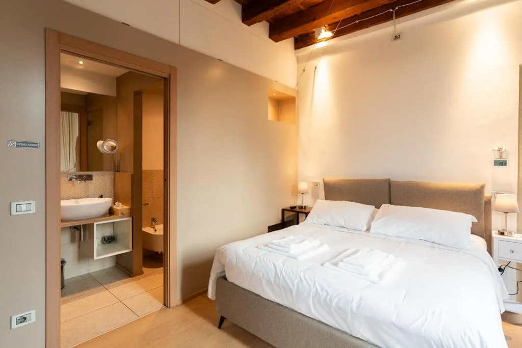 Superior Double Room with River View — La finestra sul Ponte by Postcardsfrom