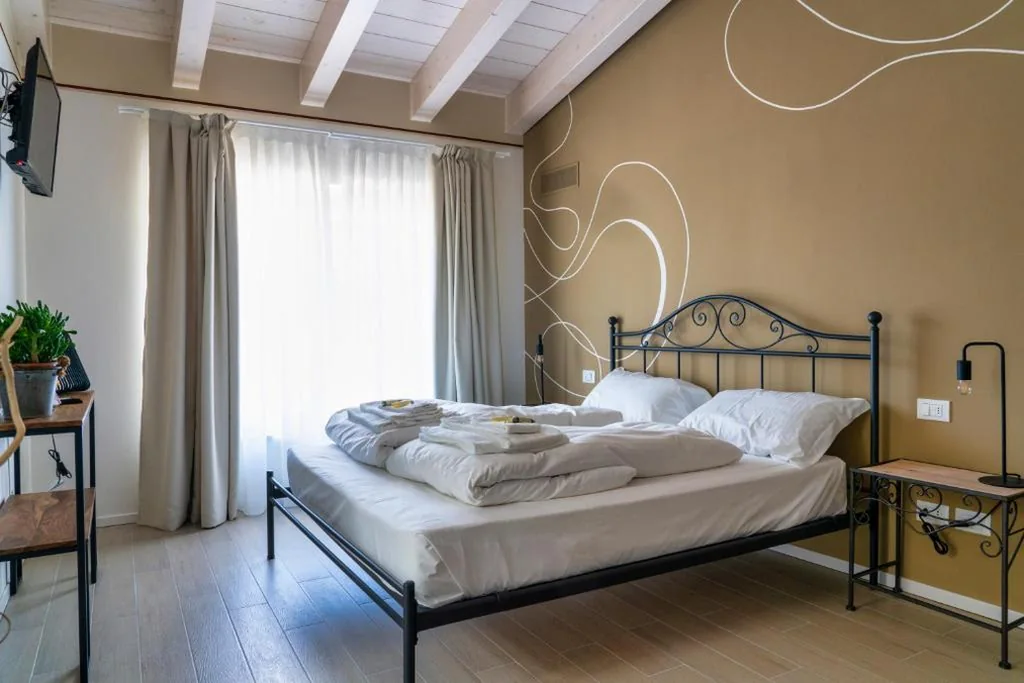 Quadruple Room — Casa Giardini