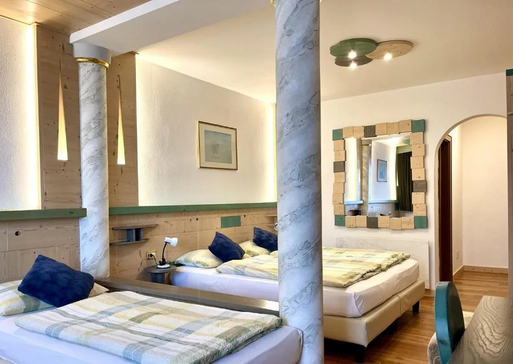 Comfort Quadruple Room — Dolomites Base Camp Hotel Olympia
