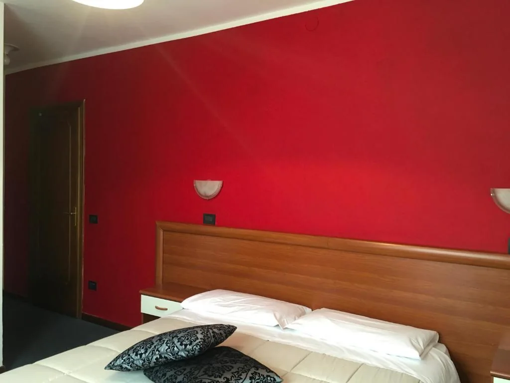 Quadruple Room with Private Bathroom — Hotel Cortina