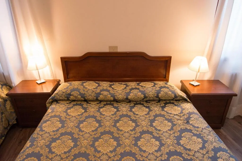 Quadruple Room with Private Bathroom — Albergo Casa Peron