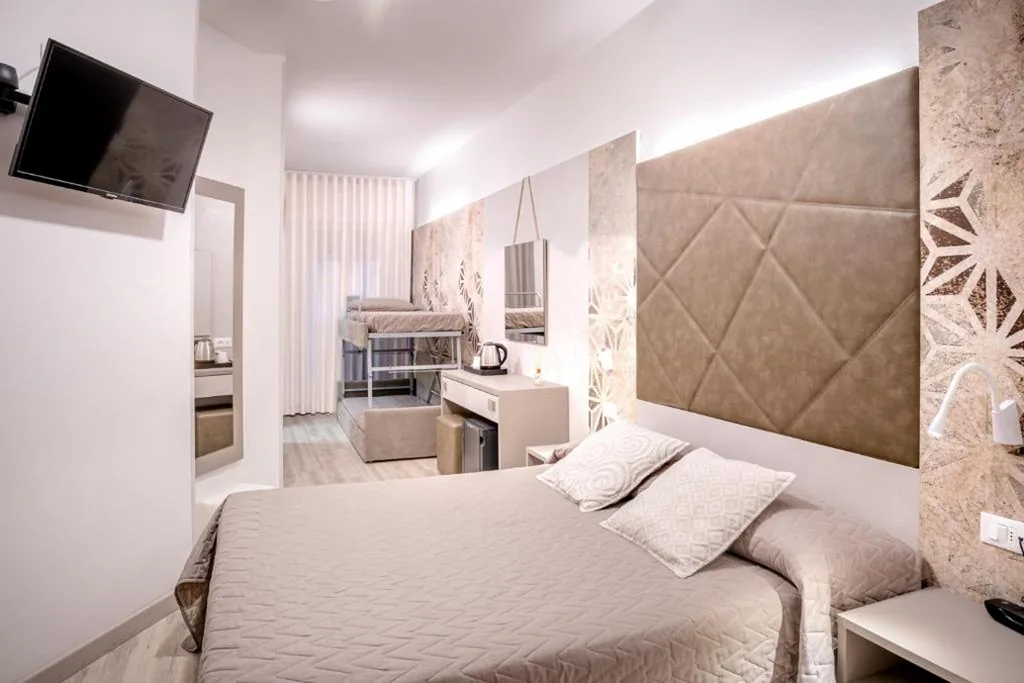 Quadruple Room with Balcony — Hotel All’Orologio