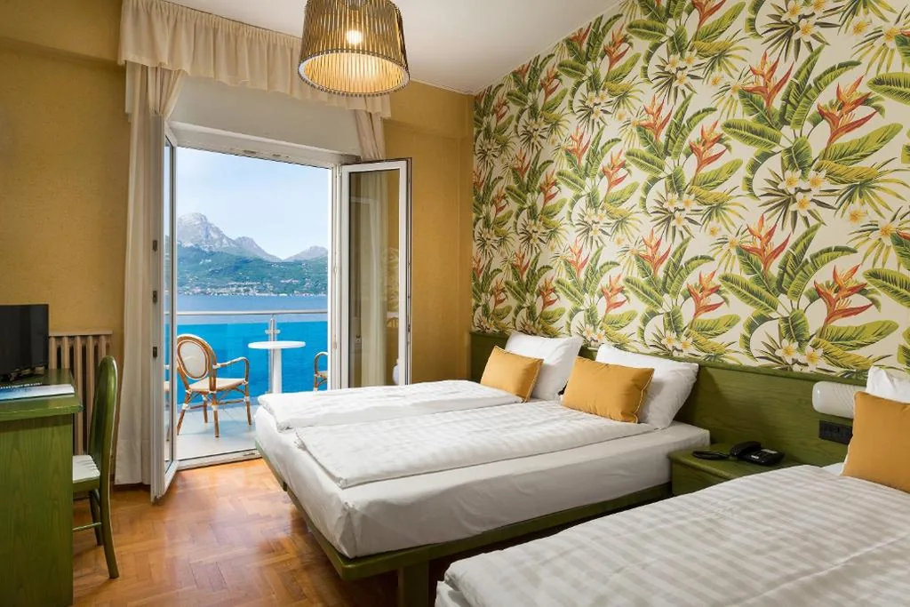 Quadruple Room with Balcony — Hotel Caribe by Double Hospitality
