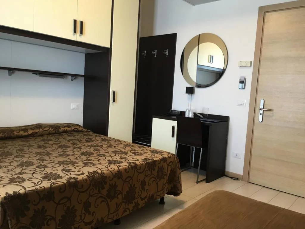 Deluxe Quadruple Room — Hotel Bellevue