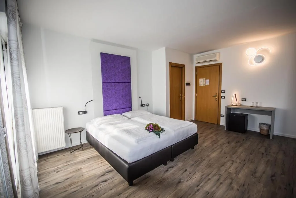 Deluxe Quadruple Room — Hotel Eden