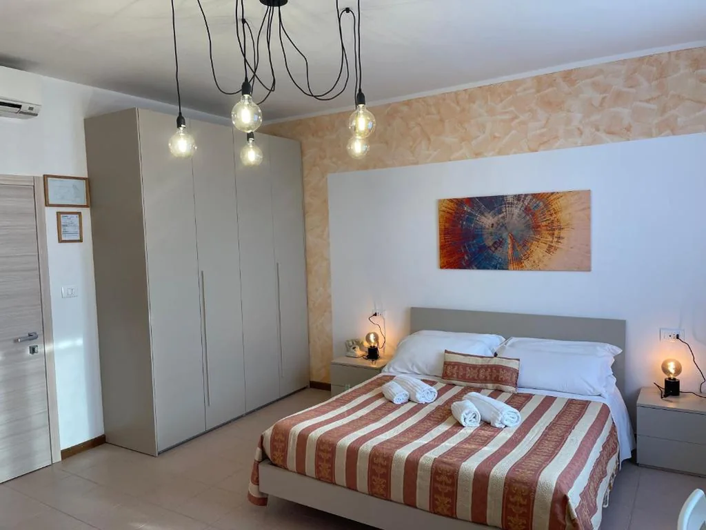 Deluxe Quadruple Room — Hotel Panoramica