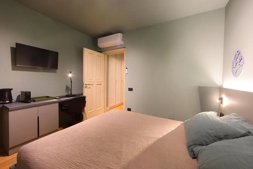 Deluxe Quadruple Room — La Pigna Suites