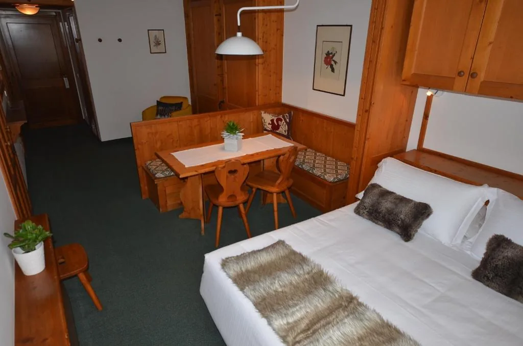Economy Quadruple Room — Hotel Cristallino d’Ampezzo