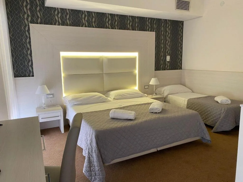 Quadruple Room — Hotel Eros