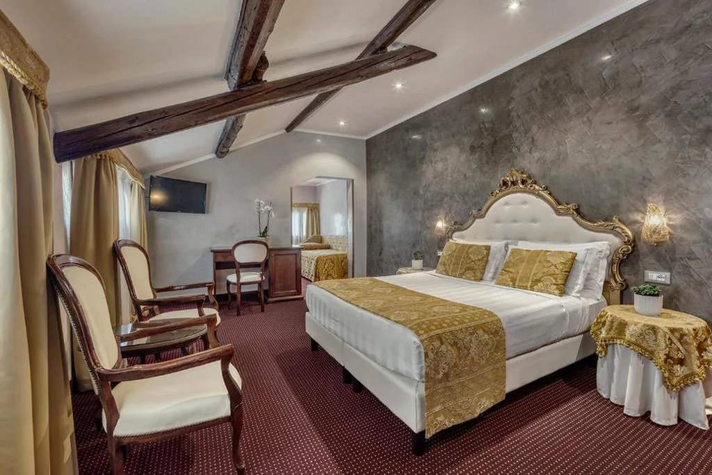 Quadruple Room — Hotel Pausania
