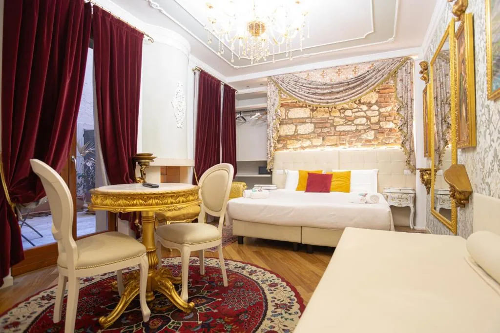 Camera Quadrupla Luxury — Giardini dell’Arena Relais