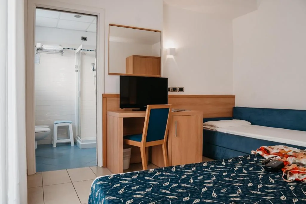 Standard Quadruple Room — Hotel Tropical