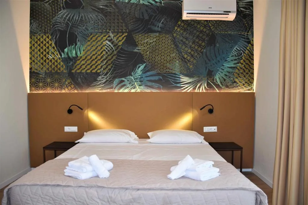 Camera Quadrupla Superior — Hotel Suez