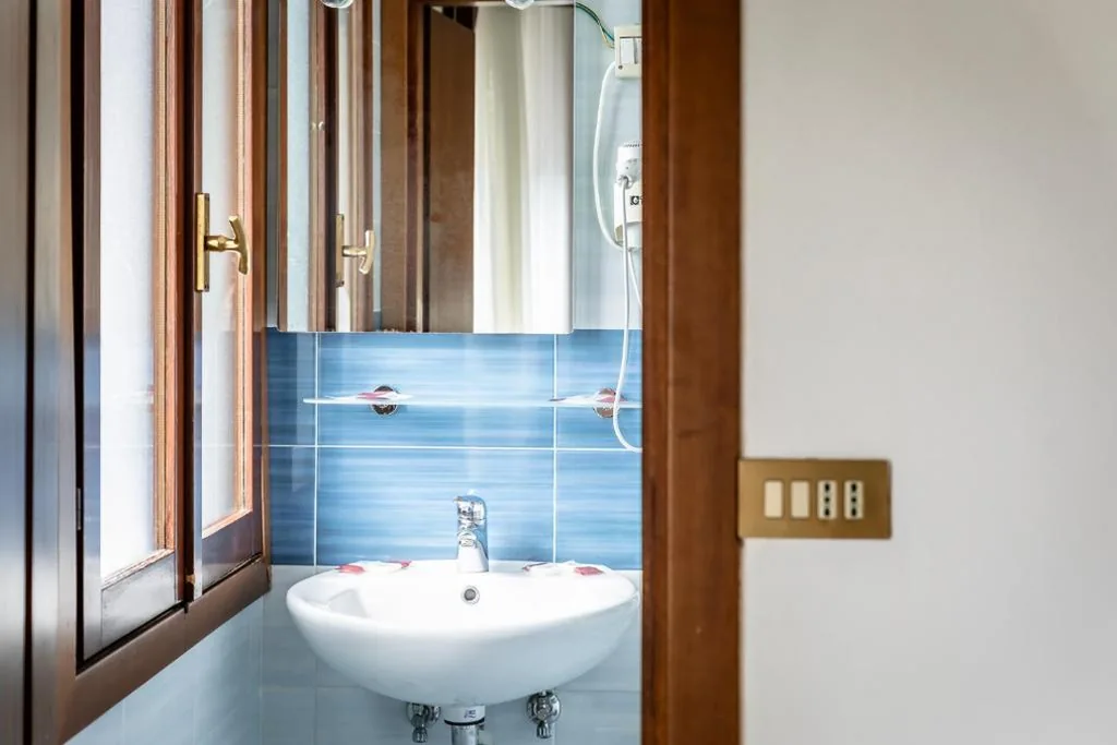 Basic Triple Room — Hotel Oasi Verde